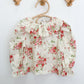 Blusa cruda con rosas